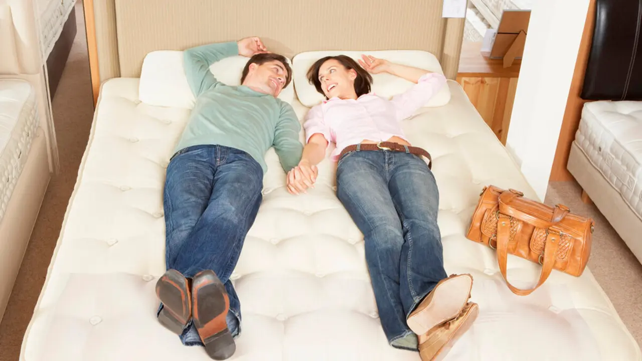couple-lying-on-bed-in-furniture-store-2025-04-03-21-18-42-utc (2)