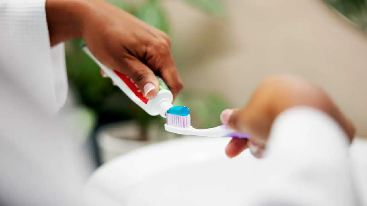 oral-hygiene-hands-and-toothpaste-on-toothbrush-i-2026-01-09-11-37-13-utc